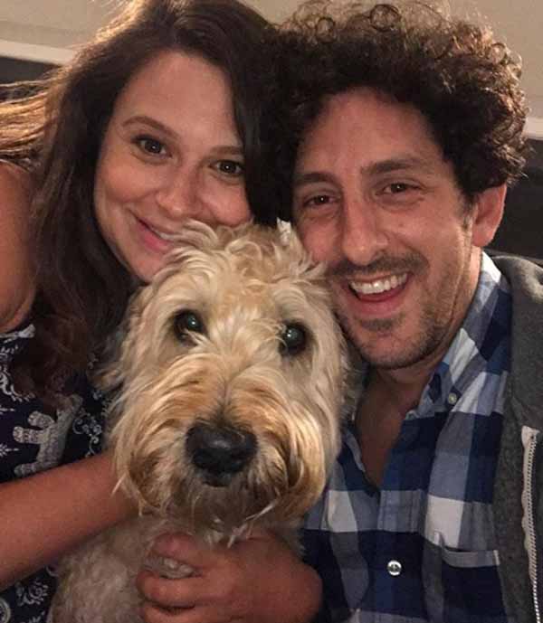 A picture of Adam Shapiro with his wife and dog.
